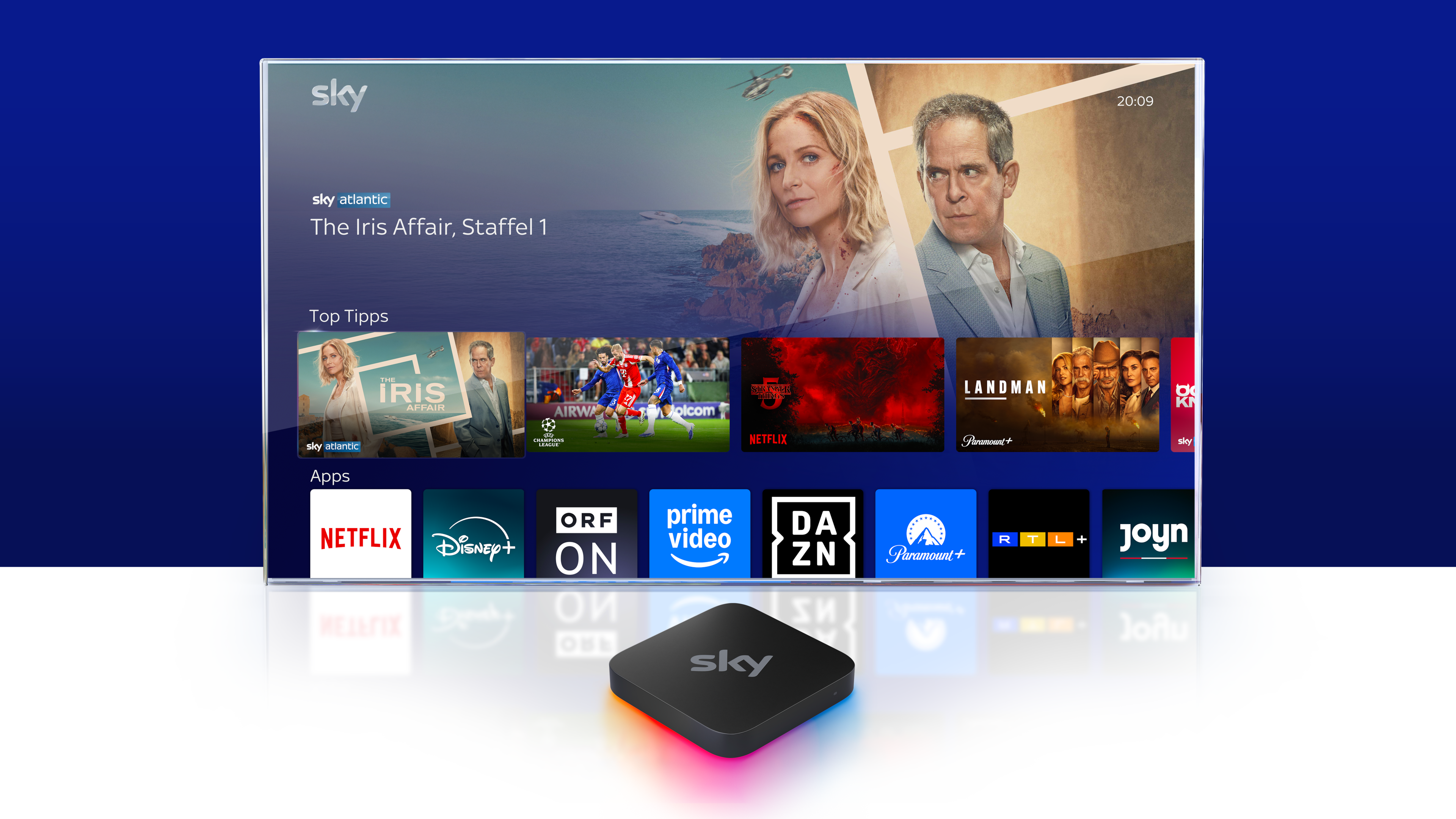 Sky Stream Box vor einem Fernseher, auf dem das Sky Stream UI zu sehen ist.